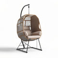 Hanging egg chair with metal frame and fabric cushions for indoor outdoor use